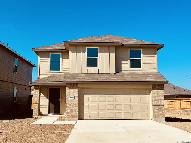 Front exterior of a new home in Sereno Springs, Converse, TX, highlighting curb appeal (Image 2).