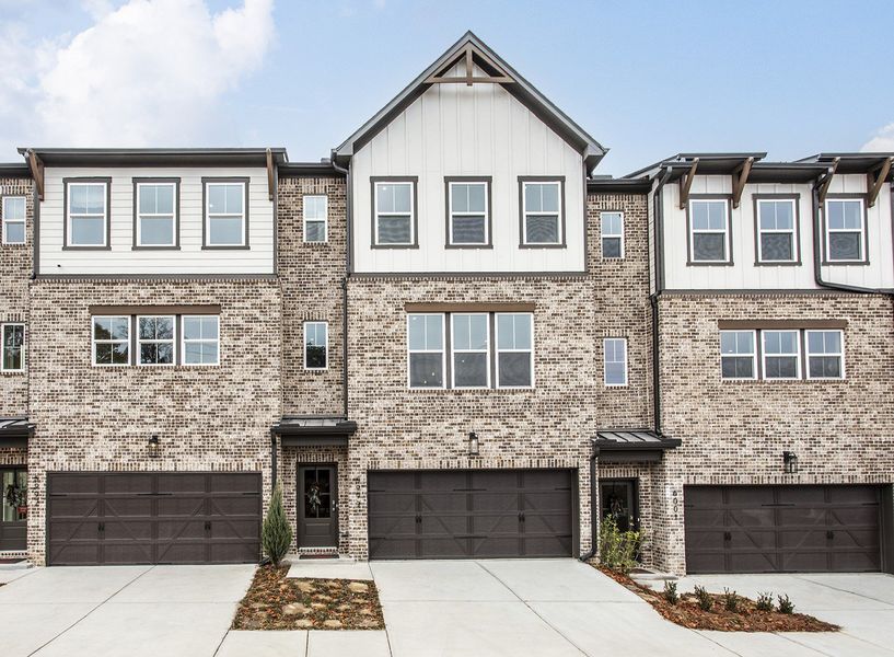 Front exterior of a new home in Towne Village at Suwanee Dam, Sugar Hill, GA, highlighting curb appeal (Image 1). Front exterior of a new home in Towne Village at Suwanee Dam, Sugar Hill, GA, highlighting curb appeal (Image 1).