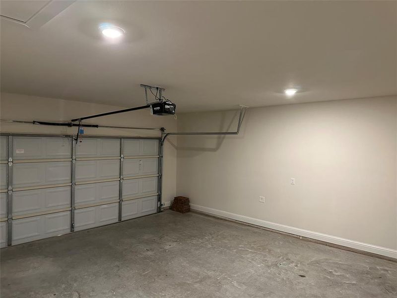 Two car garage with door opener.