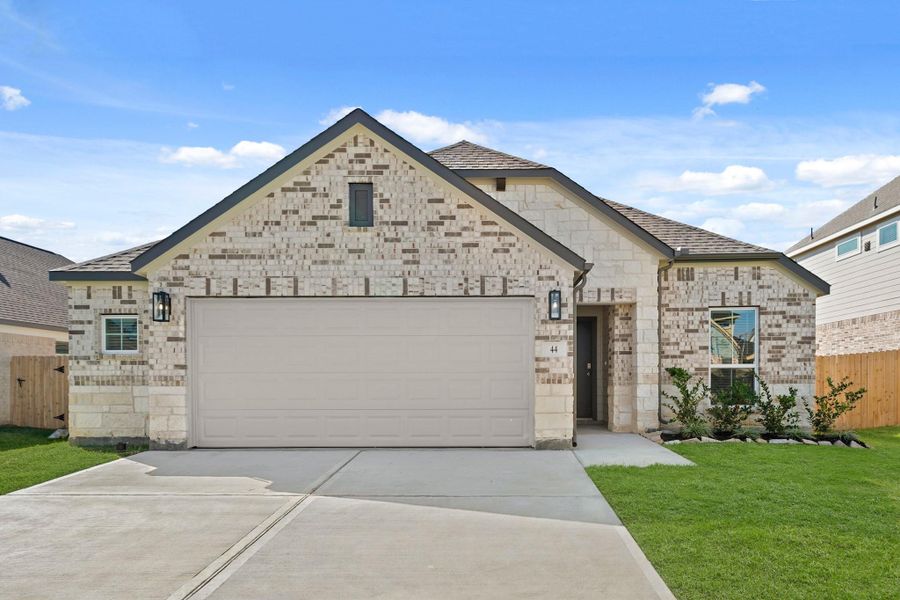 Front exterior of a new home in Beacon Hill, Waller, TX, highlighting curb appeal (Image 1). Front exterior of a new home in Beacon Hill, Waller, TX, highlighting curb appeal (Image 1).