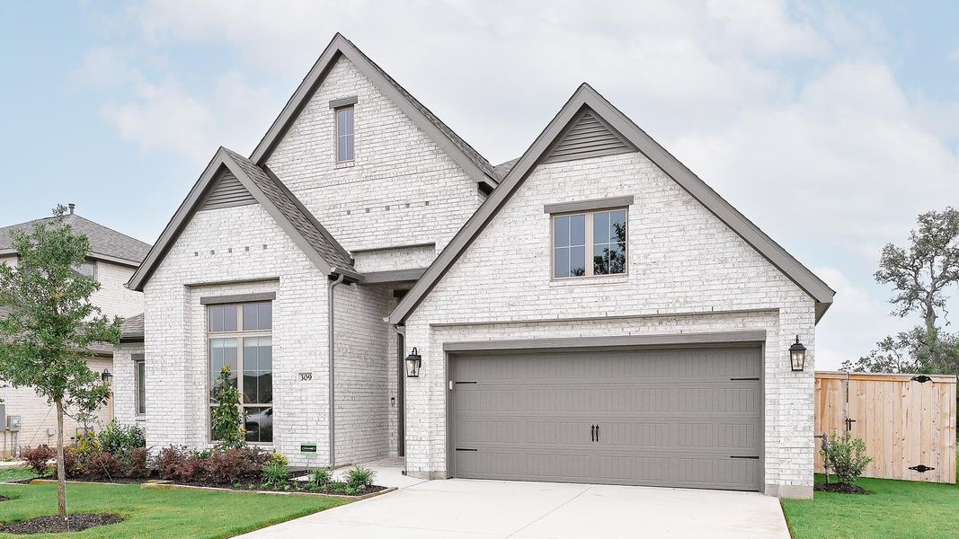 Front exterior of a new home in La Cima, San Marcos, TX, highlighting curb appeal (Image 13). Front exterior of a new home in La Cima, San Marcos, TX, highlighting curb appeal (Image 13).