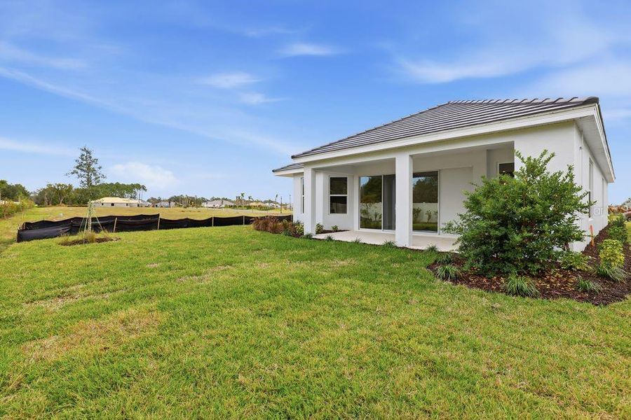 Exterior details and patio area of a home in Esplanade at Wiregrass Ranch, Wesley Chapel (Image 26). Exterior details and patio area of a home in Esplanade at Wiregrass Ranch, Wesley Chapel (Image 26).