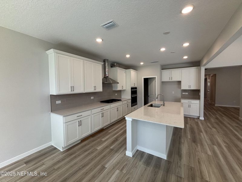 Furnished interior view inside a new home in The Cypress Series at Reserve East, Flagler Beach (Image 8).