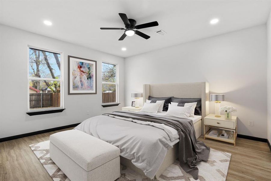 Master Bedroom with ceiling fan and light hardwood / wood-style floors