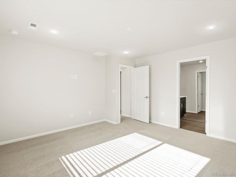 Spacious, unfurnished interior of a new home in Poudre Heights: The Lakes Collection, Windsor (Image 24).