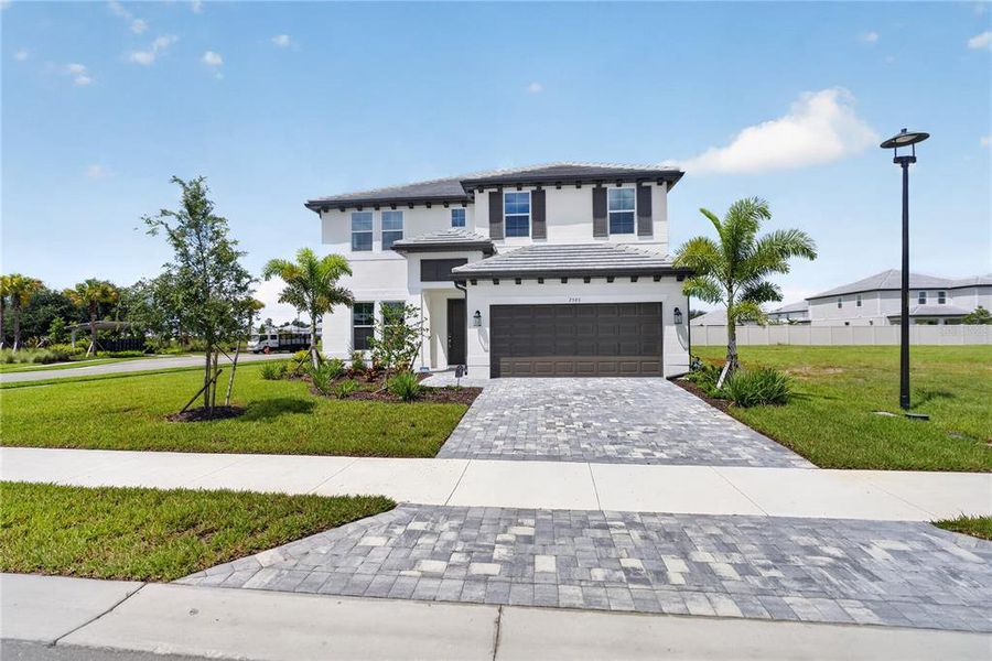 Front exterior of a new home in , Sarasota, FL, highlighting curb appeal (Image 26).