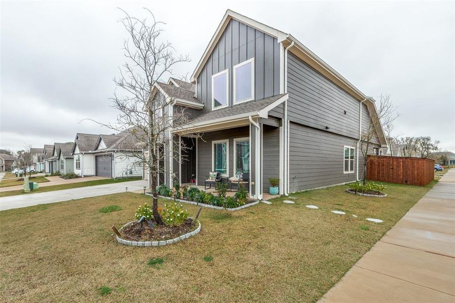 View of side of home featuring board and batten siding and a porch View of side of home featuring board and batten siding and a porch