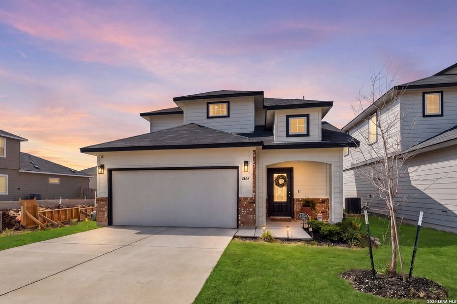 Front exterior of a new home in Willow View, Converse, TX, highlighting curb appeal (Image 2).