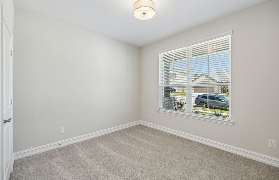 Spacious, unfurnished interior of a new home in Rosemary Fields, Godley (Image 10).