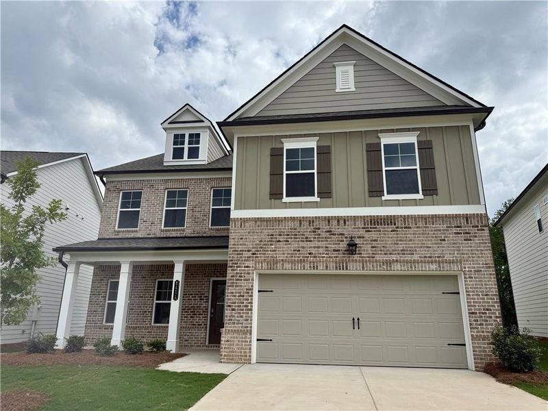 Front exterior of a new home in Ponderosa Farms Estates, Gainesville, GA, highlighting curb appeal (Image 14).
