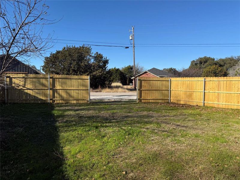 View of yard with double door gate