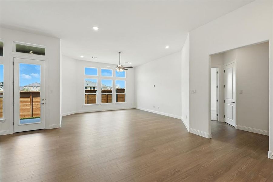 Unfurnished dining area featuring light wood-style floors, recessed lighting, and a ceiling fan