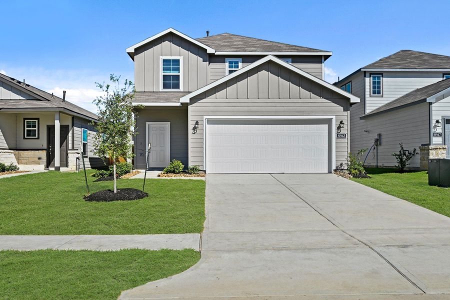 Front exterior of a new home in Northpark South, Porter, TX, highlighting curb appeal (Image 1). Front exterior of a new home in Northpark South, Porter, TX, highlighting curb appeal (Image 1).