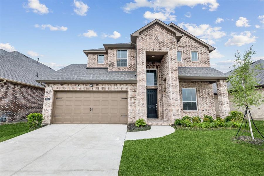 Front exterior of a new home in AnaCapri, Anna, TX, highlighting curb appeal (Image 2). Front exterior of a new home in AnaCapri, Anna, TX, highlighting curb appeal (Image 2).