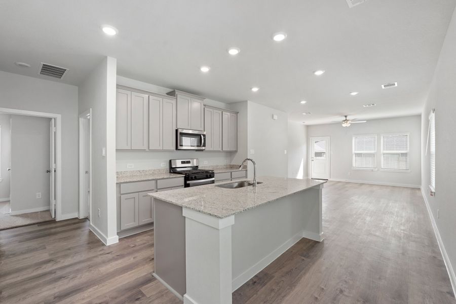 A kitchen with white cabinets. A kitchen with white cabinets.