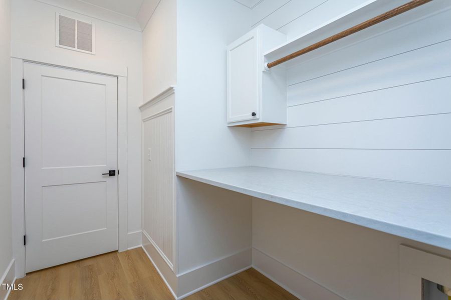 Laundry Area with Quartz Countertop