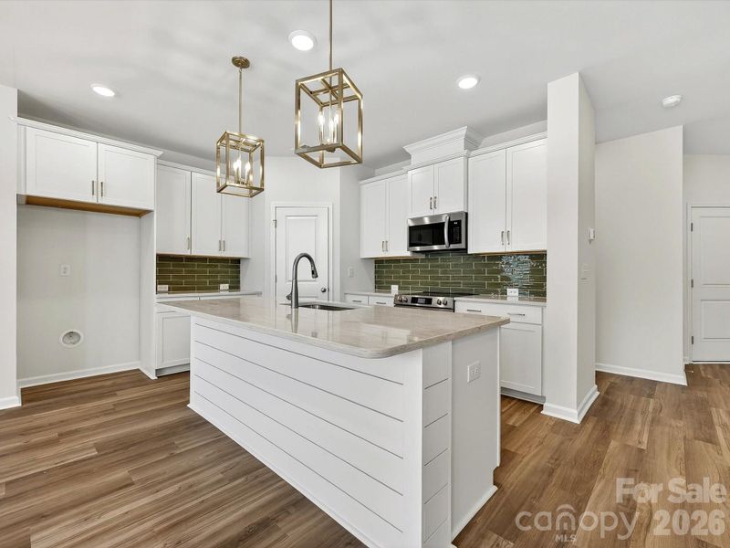 42" cabinets with soft close doors & drawers, Quartz countertops, tile backsplash, Frigidaire gallery appliances. Ship accent Island. Cooking exhaust vented to the outside