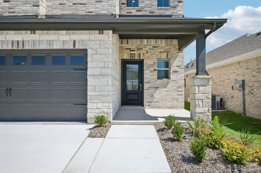Exterior details and patio area of a home in Parks at Foster Crossing - Spring Series, Anna (Image 3).