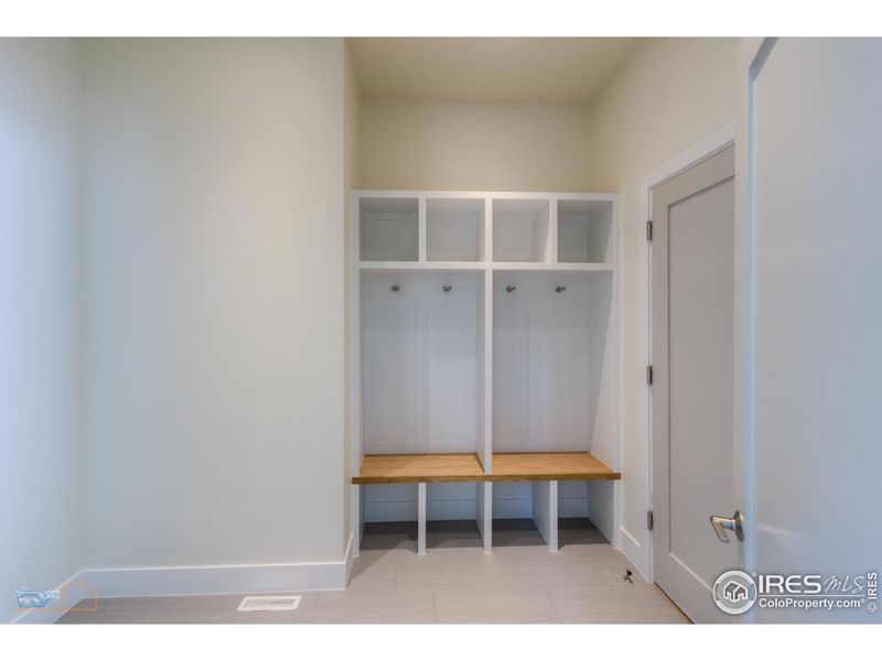 Main Floor Mud Room With Bench And Built-In Cubbies