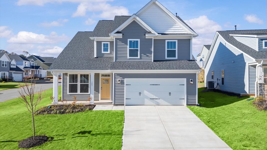 Front exterior of a new home in Fox Hollow, Spartanburg, SC, highlighting curb appeal (Image 1).