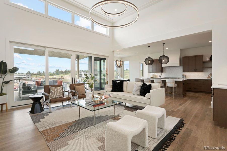 Stunning great room that opens to the modern kitchen accentuated by smooth level 5 drywall textured walls.