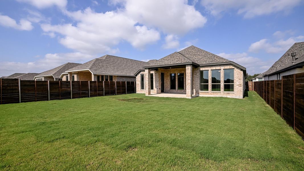 Exterior details and patio area of a home in Juniper Springs, Lockhart (Image 2).