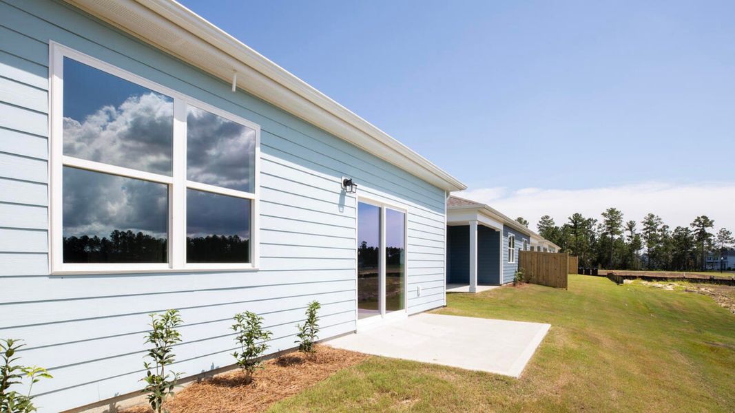 Exterior details and patio area of a home in Indigo Preserve Townhomes, Leland (Image 14).