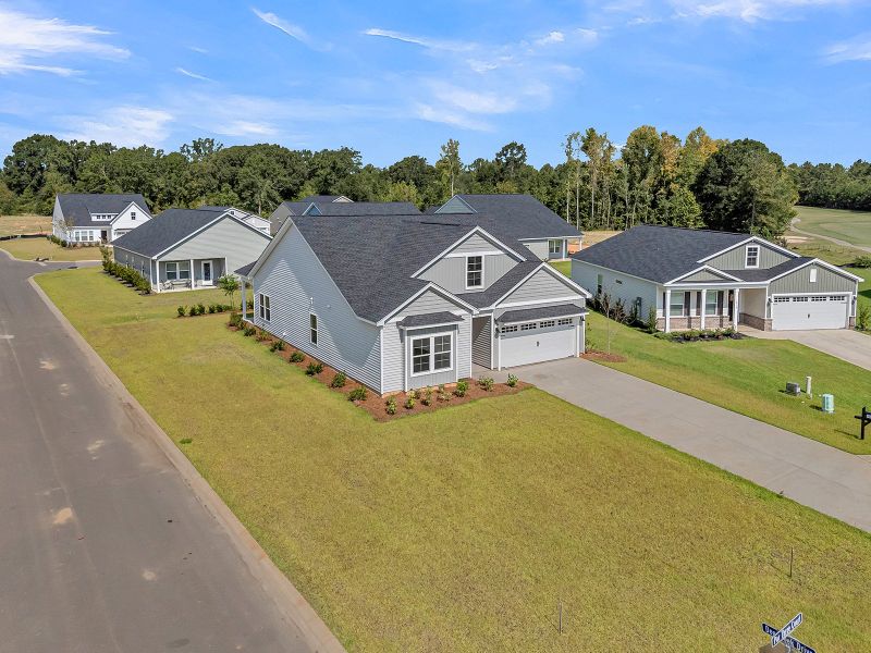 Front exterior of a new home in Fairway Woods at Wyboo, Manning, SC, highlighting curb appeal (Image 26).