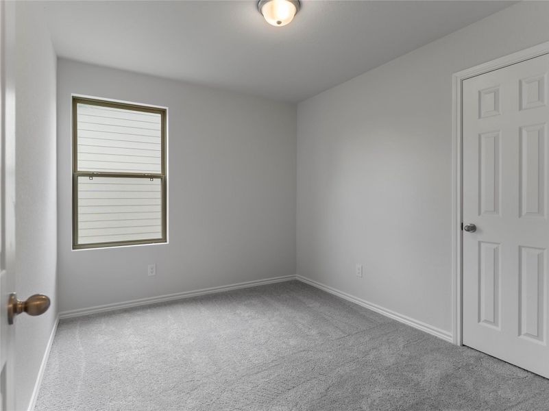 Cozy upstairs bedroom with plush carpeting. Cozy upstairs bedroom with plush carpeting.