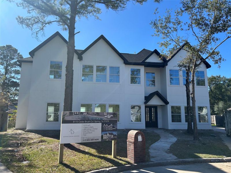 Front exterior of a new home in , Spring, TX, highlighting curb appeal (Image 6).