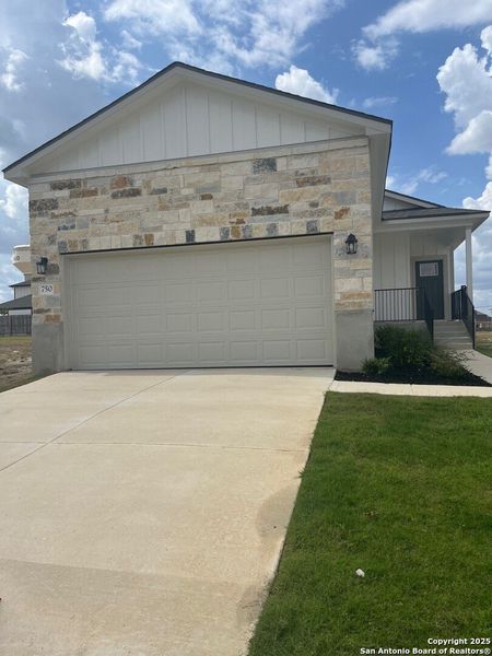Front exterior of a new home in Highland Ridge, New Braunfels, TX, highlighting curb appeal (Image 1). Front exterior of a new home in Highland Ridge, New Braunfels, TX, highlighting curb appeal (Image 1).