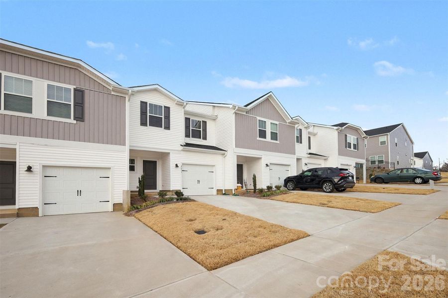 Front exterior of a new home in , Concord, NC, highlighting curb appeal (Image 21). Front exterior of a new home in , Concord, NC, highlighting curb appeal (Image 21).