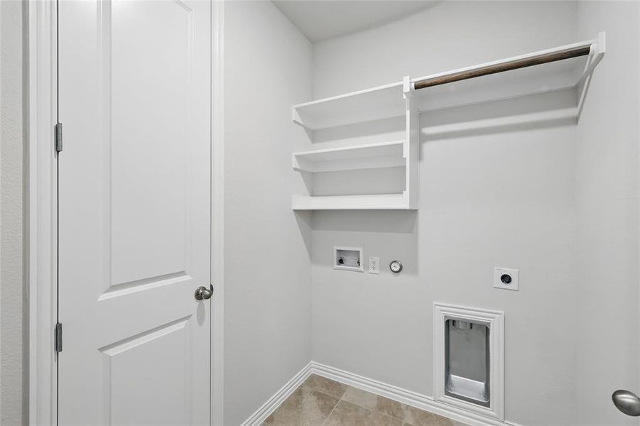 Laundry room featuring hookup for a gas dryer, electric dryer hookup, and washer hookup