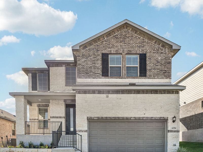 Front exterior of a new home in Comanche Ridge, San Antonio, TX, highlighting curb appeal (Image 2). Front exterior of a new home in Comanche Ridge, San Antonio, TX, highlighting curb appeal (Image 2).