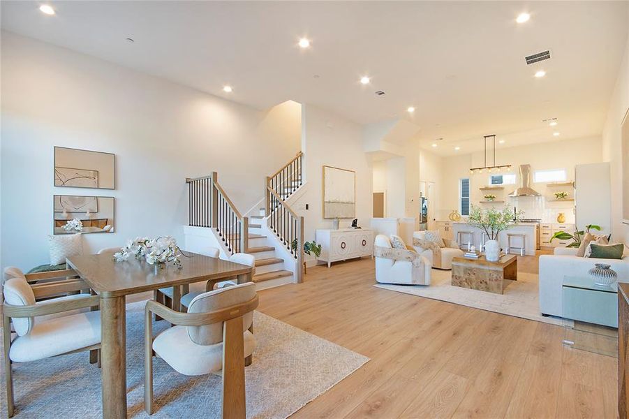 Dining room with stairway, recessed lighting, and light wood finished floors Dining room with stairway, recessed lighting, and light wood finished floors