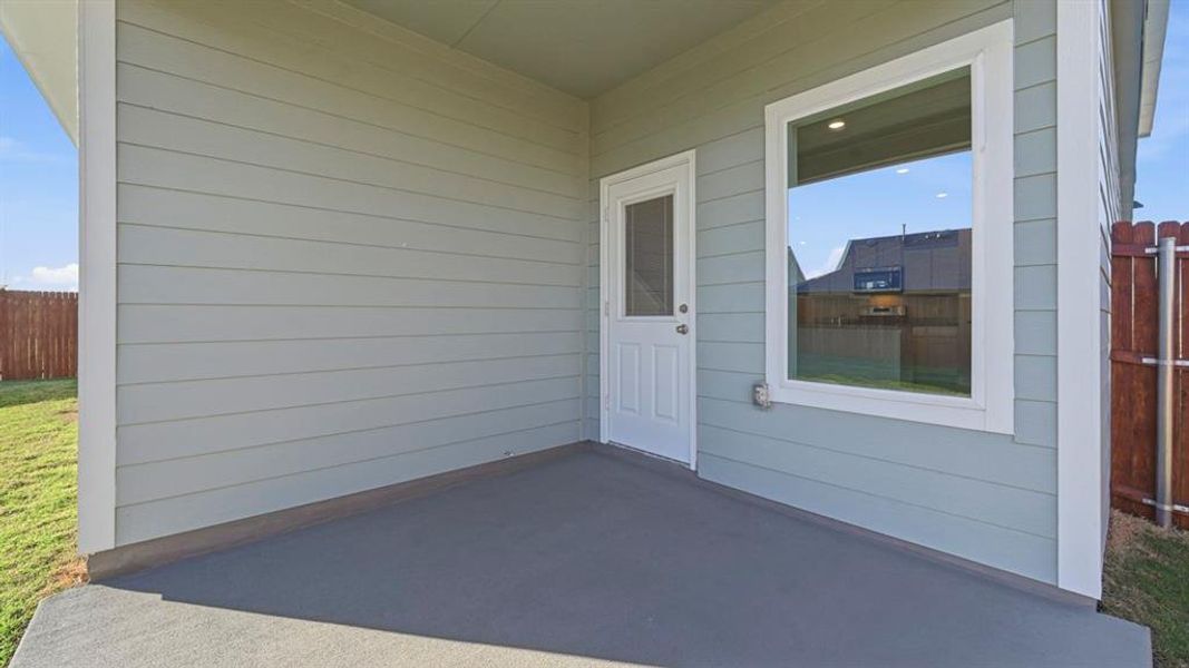 View of exterior entry featuring a patio area View of exterior entry featuring a patio area