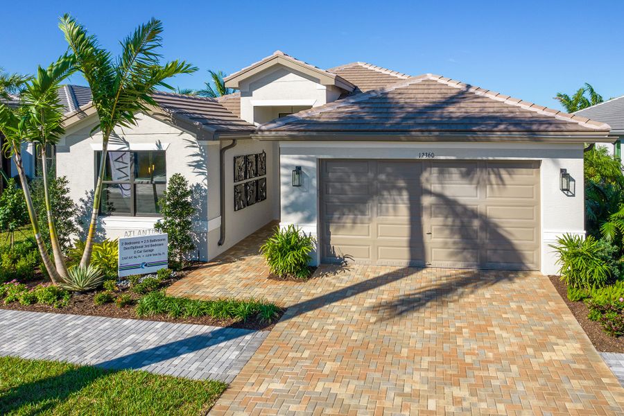 Representative exterior photo of a completed home built from the Atlantica by GL Homes in Valencia Parc at Riverland, Port St. Lucie, FL (Image 2).