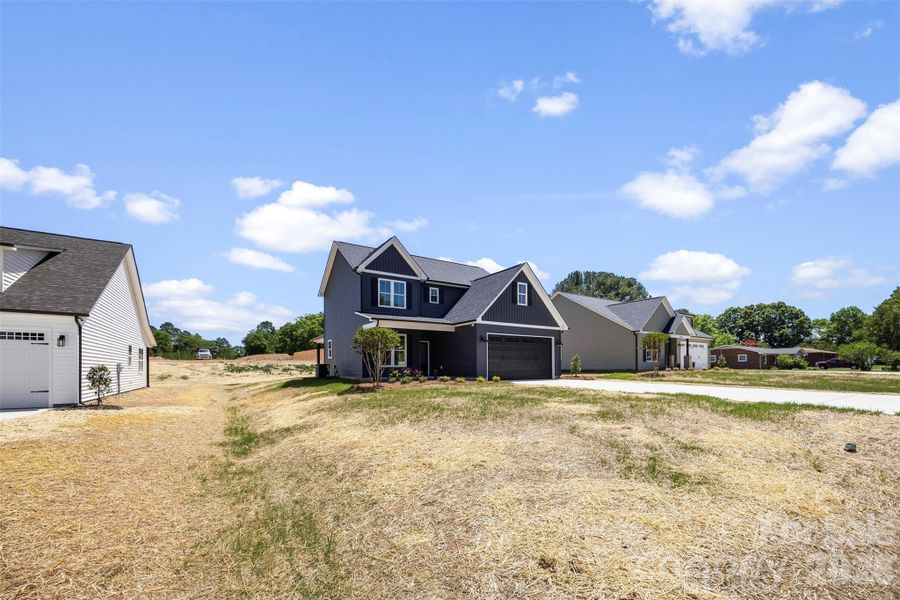 Front exterior of a new home in , Albemarle, NC, highlighting curb appeal (Image 23).