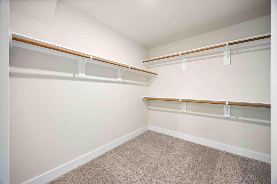 Imagine the possibilities with this oversized, walk-in primary closet!