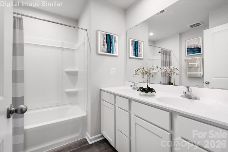 Soak, unwind, and get ready in style! This spa-inspired bath features a relaxing tub, dual vanities, and tons of storage — your daily escape starts here! Soak, unwind, and get ready in style! This spa-inspired bath features a relaxing tub, dual vanities, and tons of storage — your daily escape starts here!