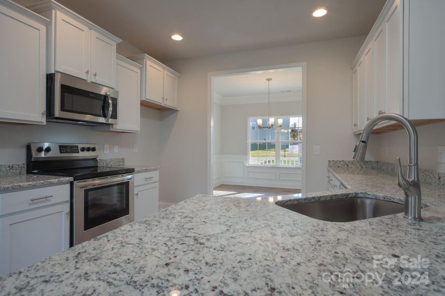 Kitchen. Representative Photograph - Colors/Options may vary.