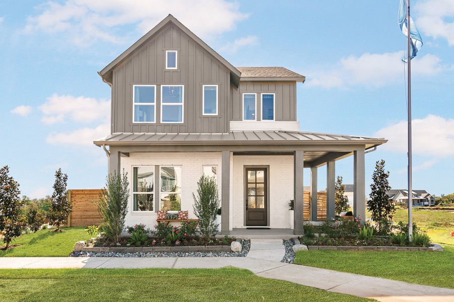 Front exterior of a new home in Indigo - Cottages Row Collection, Richmond, TX, highlighting curb appeal (Image 12). Front exterior of a new home in Indigo - Cottages Row Collection, Richmond, TX, highlighting curb appeal (Image 12).