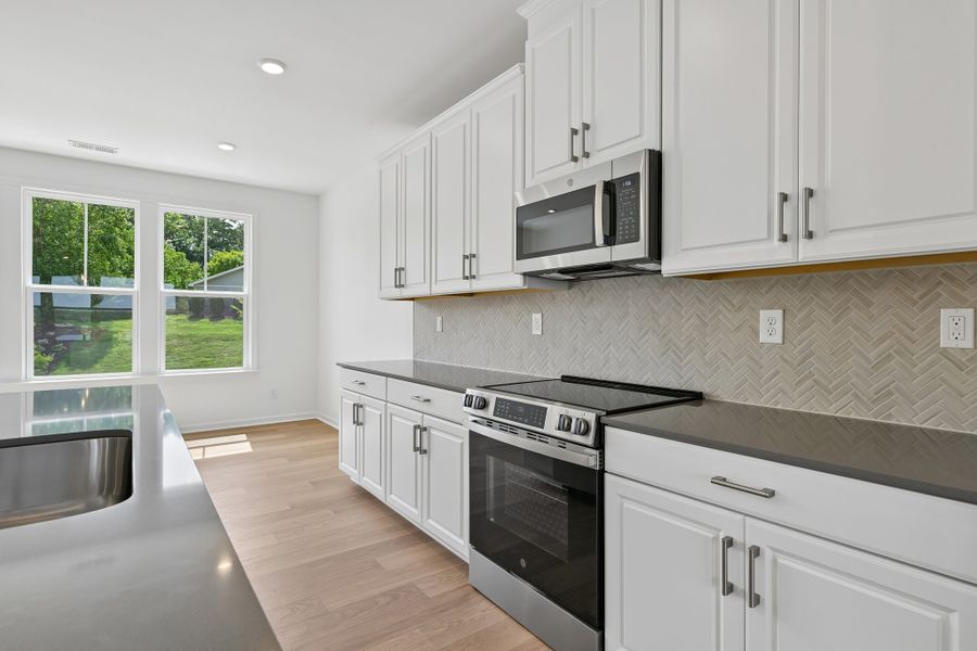 Furnished interior view inside a new home in Senata at Research Park, Charlotte (Image 12). Furnished interior view inside a new home in Senata at Research Park, Charlotte (Image 12).