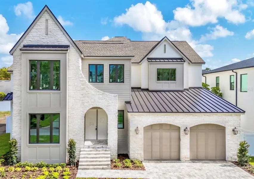 Front exterior of a new home in , Tampa, FL, highlighting curb appeal (Image 1). Front exterior of a new home in , Tampa, FL, highlighting curb appeal (Image 1).