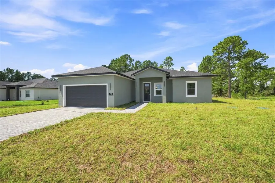 Front exterior of a new home in , Ocala, FL, highlighting curb appeal (Image 2). Front exterior of a new home in , Ocala, FL, highlighting curb appeal (Image 2).