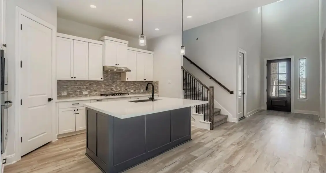 Furnished interior view inside a new home in 6 Creeks, Kyle (Image 3).