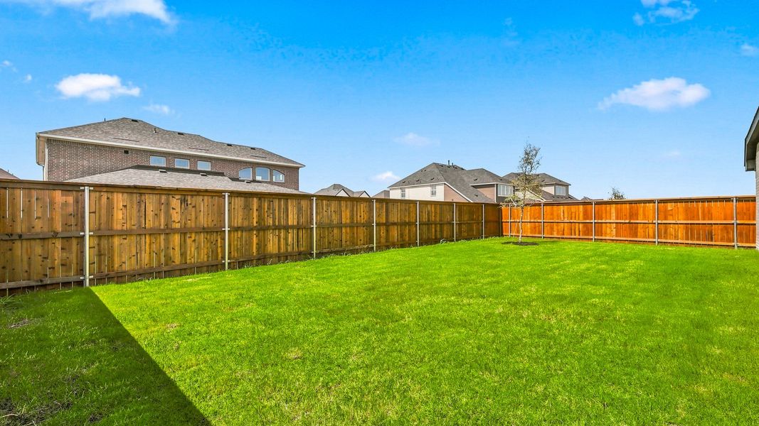 Exterior details and patio area of a home in Green Meadows Premier, Celina (Image 20).