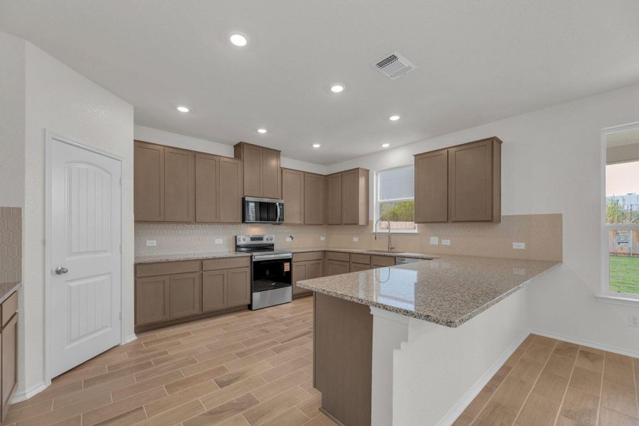 Furnished interior view inside a new home in Mustang Valley, Manor (Image 13).