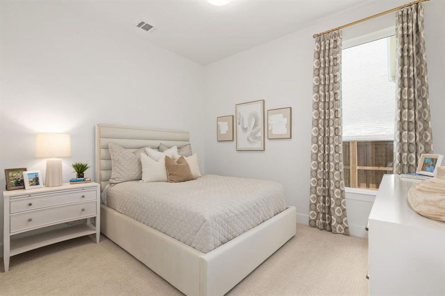 Bedroom with light carpet Bedroom with light carpet