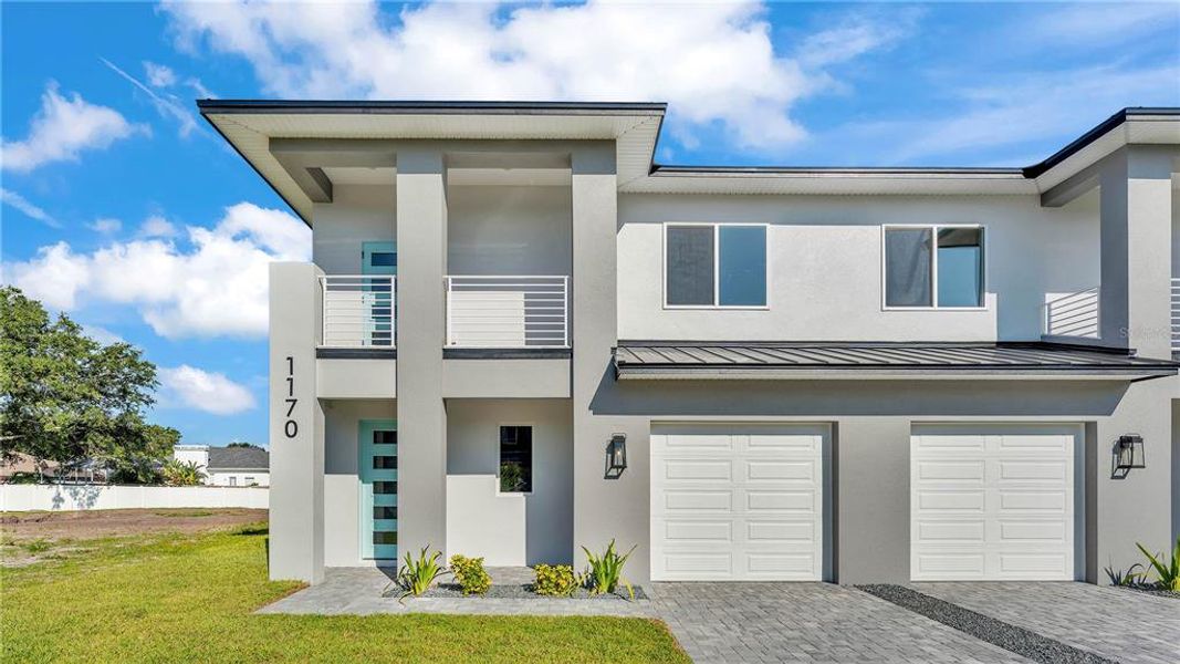 Front exterior of a new home in , Lakeland, FL, highlighting curb appeal (Image 2).